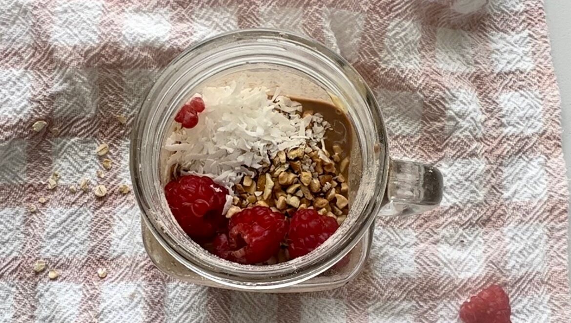 Breakfast meal prep overnight oats with raspberries, coconut, chopped nuts